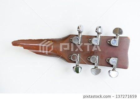 part of broken wood acoustic guitar isolated on white background 137271659