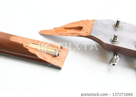 part of broken wood acoustic guitar isolated on white background 137271660
