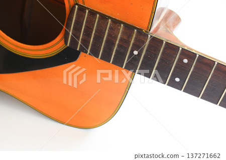 brown wood acoustic guitar isolated on white background 137271662