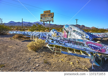 Graffiti Covered Abandoned Airplane in Nevada Desert Near Beatty with Roadside Sign Graffiti Covered Abandoned Airplane in Nevada Desert Near Beatty with Roadside Sign 137271853