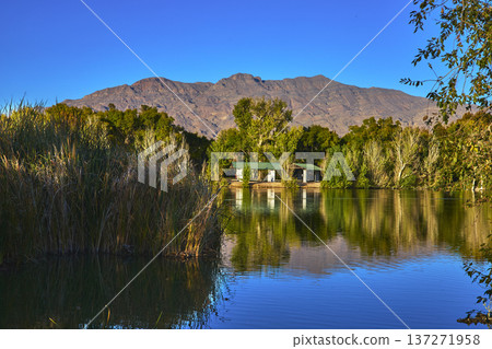 Golden Hour Pond Reflections and Mountain Scenery at Floyd Lamb Park Las Vegas Golden Hour Pond Reflections and Mountain Scenery at Floyd Lamb Park Las Vegas 137271958