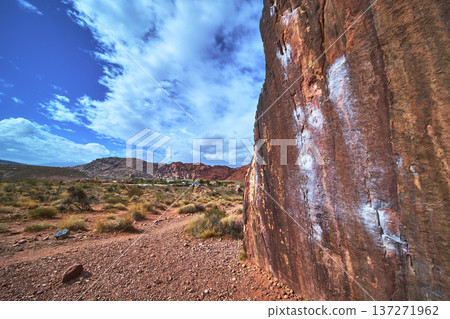 Red Rock Canyon Desert Landscape With Chalk Marked Rock Climbing Wall And Blue Sky Red Rock Canyon Desert Landscape With Chalk Marked Rock Climbing Wall And Blue Sky 137271962