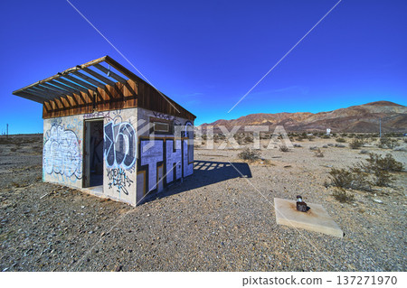 Abandoned Graffiti Covered Structure Desert Landscape and Mountains in Yermo California Abandoned Graffiti Covered Structure Desert Landscape and Mountains in Yermo California 137271970
