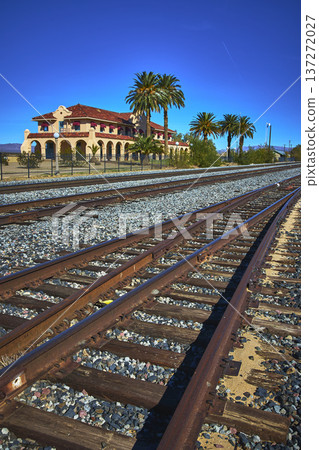 Train Tracks Palm Trees and Historic Kelso Visitors Center in Mojave California 137272027