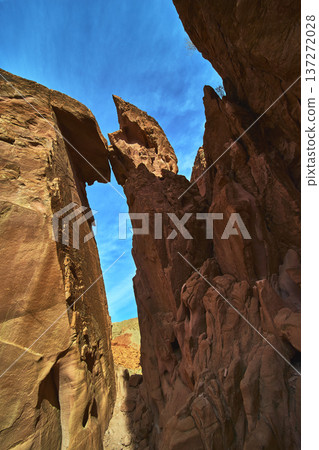 Bowl of Fire Arch Red Sandstone Cliffs and Blue Sky in Nevada Desert Bowl of Fire Arch Red Sandstone Cliffs and Blue Sky in Nevada Desert 137272028