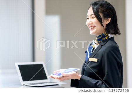 Woman at reception Woman at reception 137272406