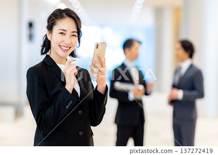 Business woman with a smartphone 137272419