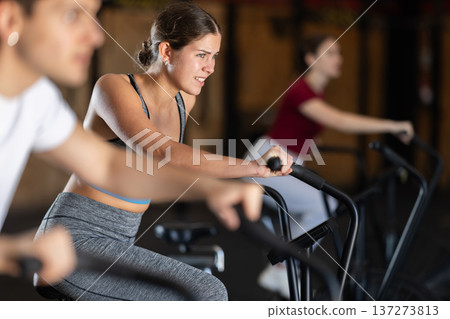 Woman in the top is engaged in an airbike 137273813