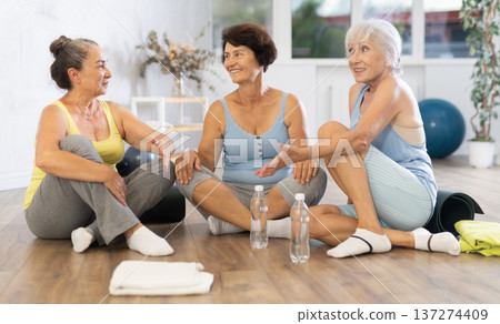 Group of elderly women talking in fitness studio 137274409