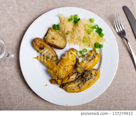 Fried chicken with potatoes and cabbage 137274912
