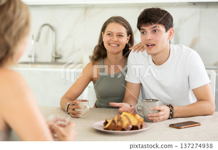 Young girl and guy have nice conversation with woman 137274938