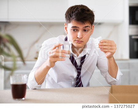 young man suffering from hangover young man suffering from hangover 137275027