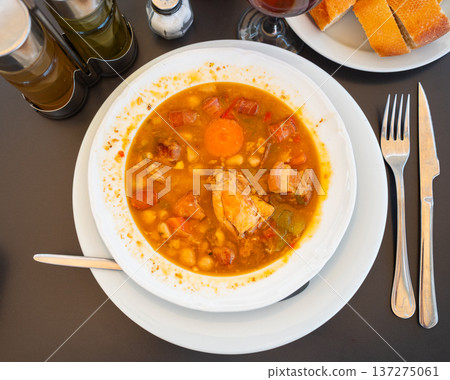 Hearty legume stew with vegetables 137275061