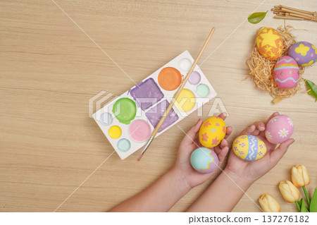 Easter Creativity. Colorful eggs and paint palette for festive crafting. 137276182