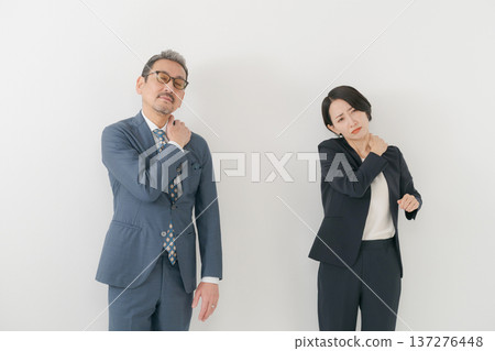 Business person suffering from stiff shoulder Business person suffering from stiff shoulder 137276448