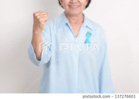 Elderly with blue Ribbon for Prostate Cancer Awareness month, April Child Abuse Prevention, National Bullying, September Addiction Recovery, May Chronic Fatigue Syndrome and January Human Trafficking Elderly with blue Ribbon for Prostate Cancer Awareness month, April Child Abuse Prevention, National Bullying, September Addiction Recovery, May Chronic Fatigue Syndrome and January Human Trafficking 137276601