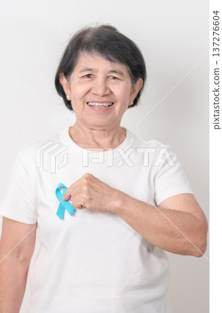 Elderly with blue Ribbon for Prostate Cancer Awareness month, April Child Abuse Prevention, National Bullying, September Addiction Recovery, May Chronic Fatigue Syndrome and January Human Trafficking 137276604