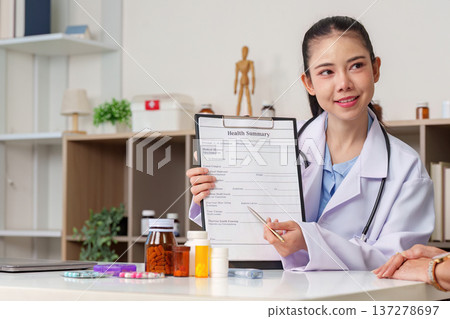 Healthcare professional explaining health summary to patient 137278697