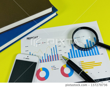 Colorful graphs, smartphone and magnifying glass Colorful graphs, smartphone and magnifying glass 137278736