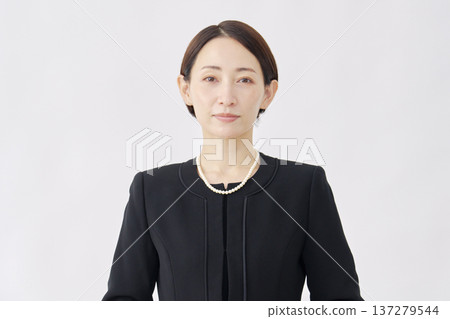Portrait of a woman in mourning clothes, looking at camera, white background Portrait of a woman in mourning clothes, looking at camera, white background 137279544