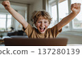 Happy child laptop joy success excitement indoor home learning fun 137280139