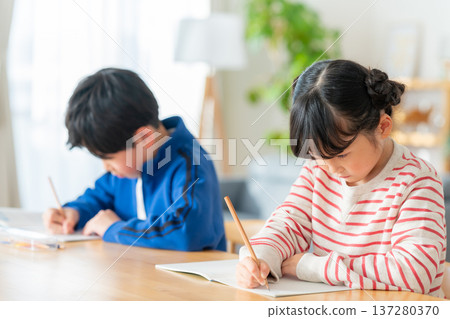 Children studying in the living room 137280370