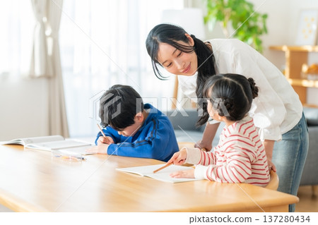 Children studying in the living room Children studying in the living room 137280434