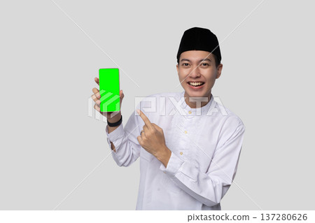 Individual in white shirt showcasing mockup smiling broadly 137280626