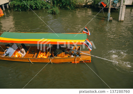 asia travel with people travel and take picture with large buddhist and beautiful temple with river at Bangkok Thailand in summer season asia travel with people travel and take picture with large buddhist and beautiful temple with river at Bangkok Thailand in summer season 137280760