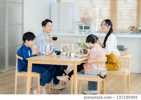 Family of four eating in the dining room Family of four eating in the dining room 137280995