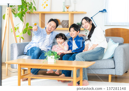Family watching TV Family watching TV 137281148