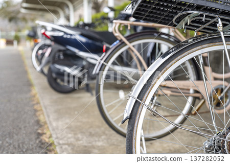 Colorful bicycles lined up in the bicycle parking lot in the park Bicycle parking lot Bicycle Colorful bicycles lined up in the bicycle parking lot in the park Bicycle parking lot Bicycle 137282052