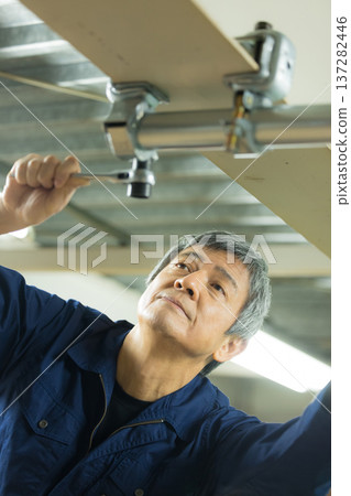 Men working at the factory 137282446