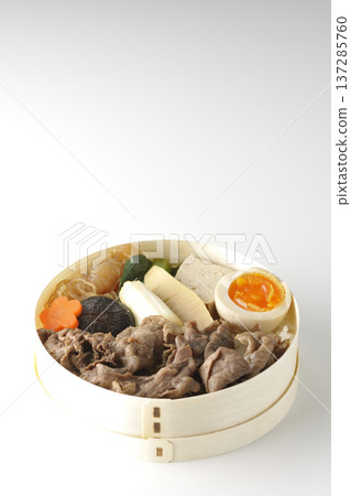 Sukiyaki bento box with plenty of ingredients photographed against a white background Sukiyaki bento box with plenty of ingredients photographed against a white background 137285760