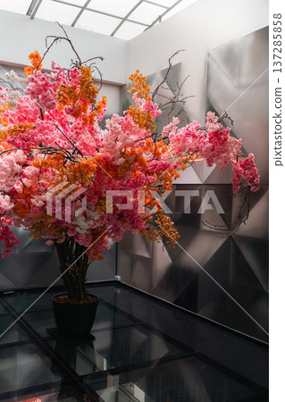 Decorative Flower Tree in Modern Shopping Mall Interior Decorative Flower Tree in Modern Shopping Mall Interior 137285858