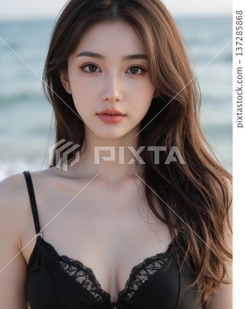 Long-haired woman relaxing by the sea 137285868