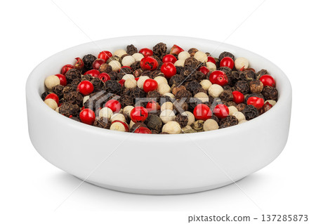 Pepper mix in a ceramic bowl isolated on white background. 137285873