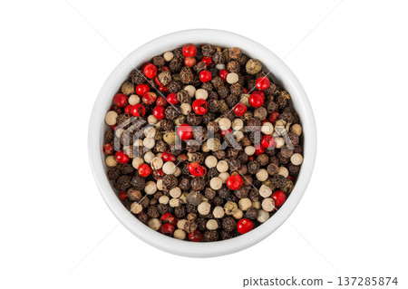Pepper mix in a ceramic bowl isolated on white background. Top view 137285874