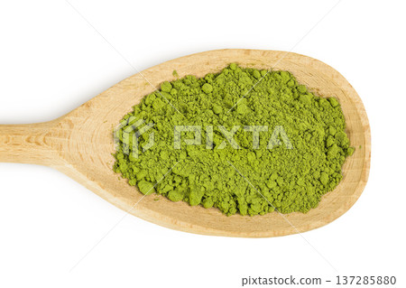 Green matcha powder in wooden spoon isolated on white background. Top view 137285880
