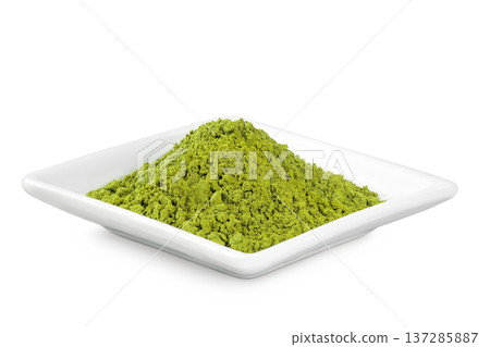 Green matcha powder in ceramic bowl isolated on white background. Top view Green matcha powder in ceramic bowl isolated on white background. Top view 137285887