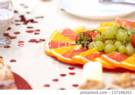 Fresh fruit platter with citrus, grapes and strawberries Fresh fruit platter with citrus, grapes and strawberries 137286261