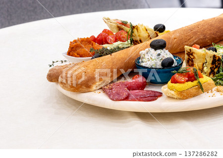 snack platter with bread, dips appetizer 137286282