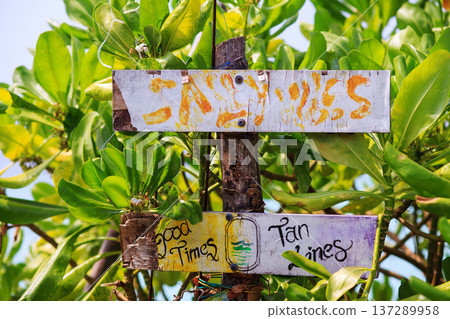 Weathered signs whisper tropical charm and joy Weathered signs whisper tropical charm and joy 137289958
