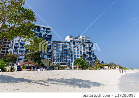 Clear blue sky above modern beachfront buildings Clear blue sky above modern beachfront buildings 137290095