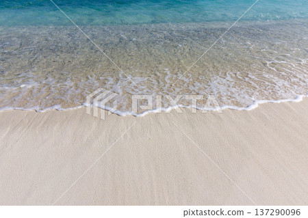 Clear waves kiss sandy shores gently Clear waves kiss sandy shores gently 137290096