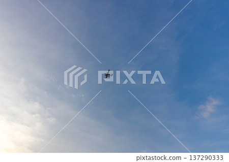 Small airplane soars high against vast blue sky Small airplane soars high against vast blue sky 137290333