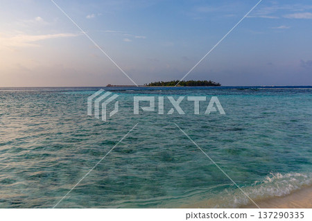 Crystal waters ripple toward a distant island Crystal waters ripple toward a distant island 137290335