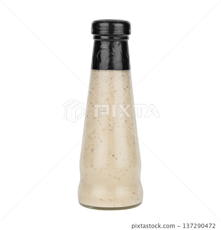 Garlic sauce in a glass bottle isolated on white background Garlic sauce in a glass bottle isolated on white background 137290472