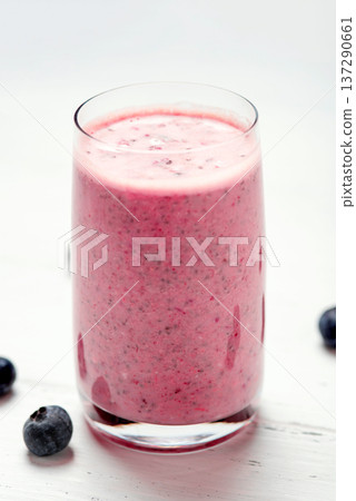 Two glasses of berry smoothie with chia and fresh berries Two glasses of berry smoothie with chia and fresh berries 137290661