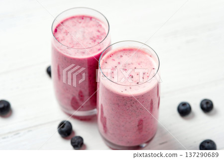 Two glasses of berry smoothie with chia and fresh berries 137290689